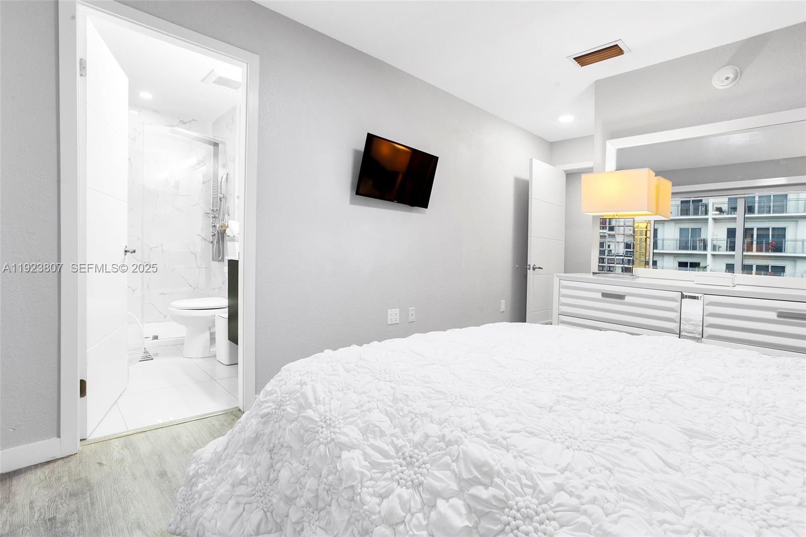 25872 Southwest 139th Path Homestead, FL 33032 - Photo 19 of 51 a bedroom with a bed and a flat screen tv