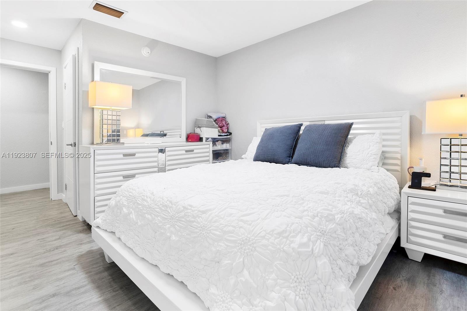 25872 Southwest 139th Path Homestead, FL 33032 - Photo 20 of 51 a large white bed in a room next to a window