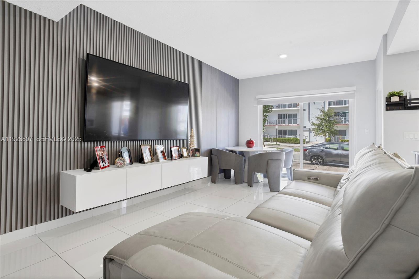 25872 Southwest 139th Path Homestead, FL 33032 - Photo 2 of 51 a living room with furniture and a flat screen tv