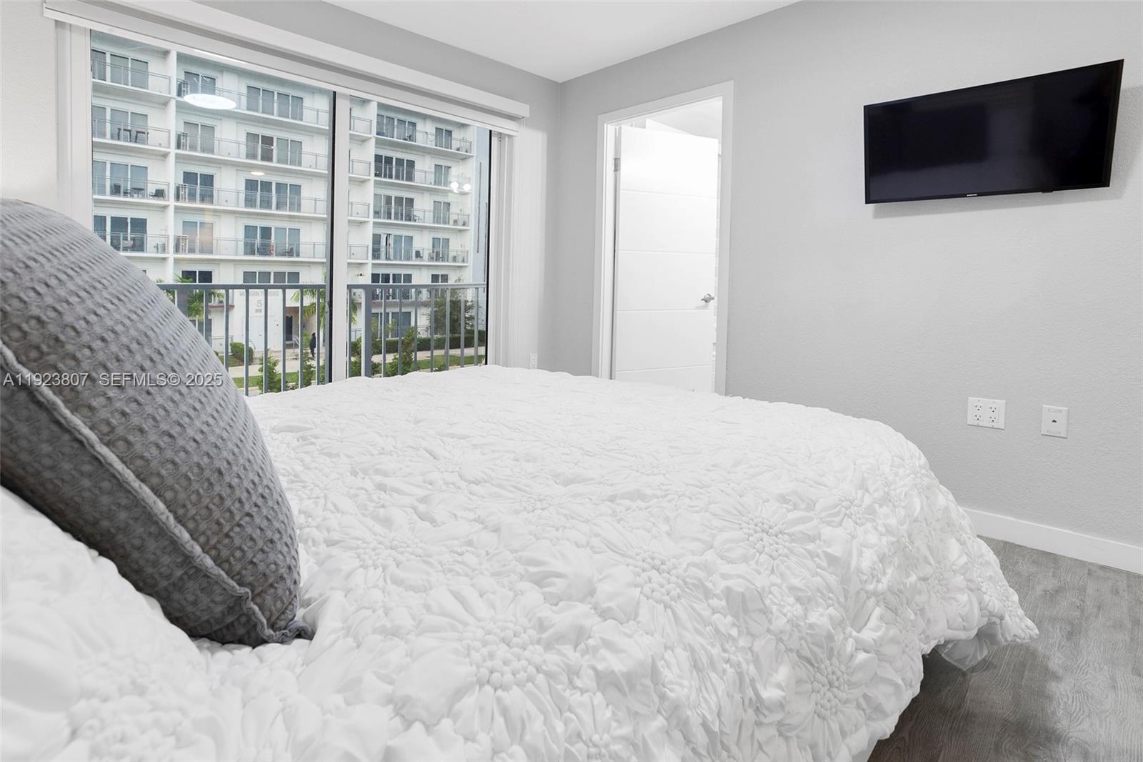 25872 Southwest 139th Path Homestead, FL 33032 - Photo 21 of 51 a view of a livingroom with a flat screen tv