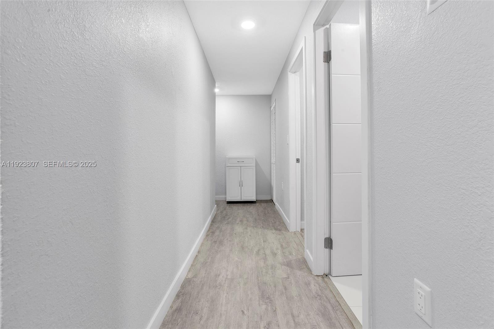 25872 Southwest 139th Path Homestead, FL 33032 - Photo 28 of 51 a view of a hallway with wooden floor