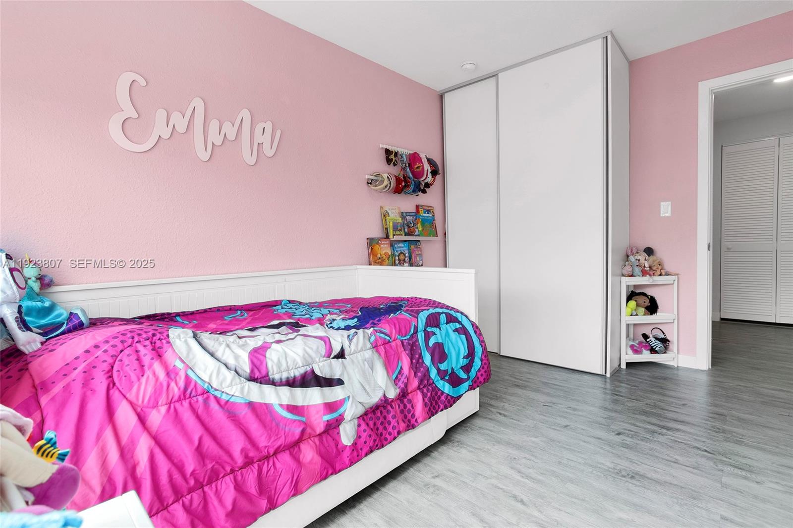 25872 Southwest 139th Path Homestead, FL 33032 - Photo 29 of 51 a bedroom with a bed and a wooden floor