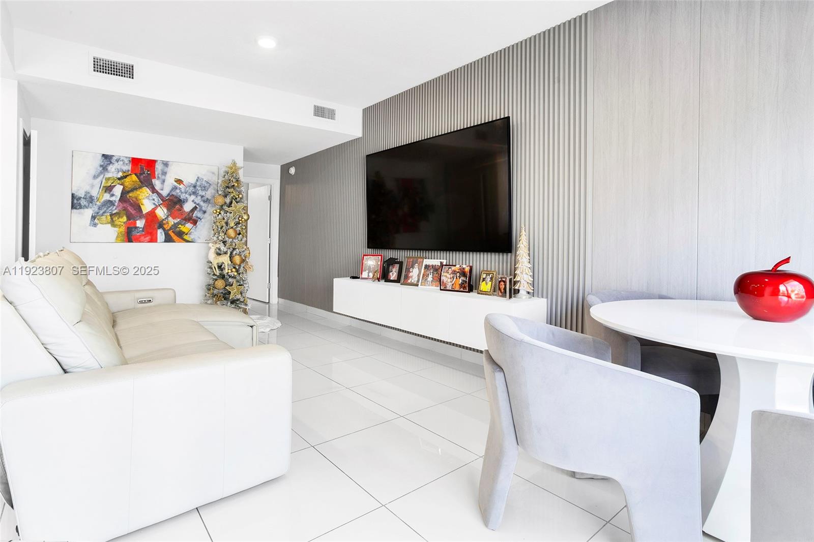 25872 Southwest 139th Path Homestead, FL 33032 - Photo 3 of 51 a living room with furniture and a flat screen tv