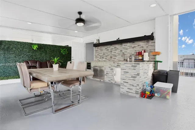 a dining room with furniture and a fireplace