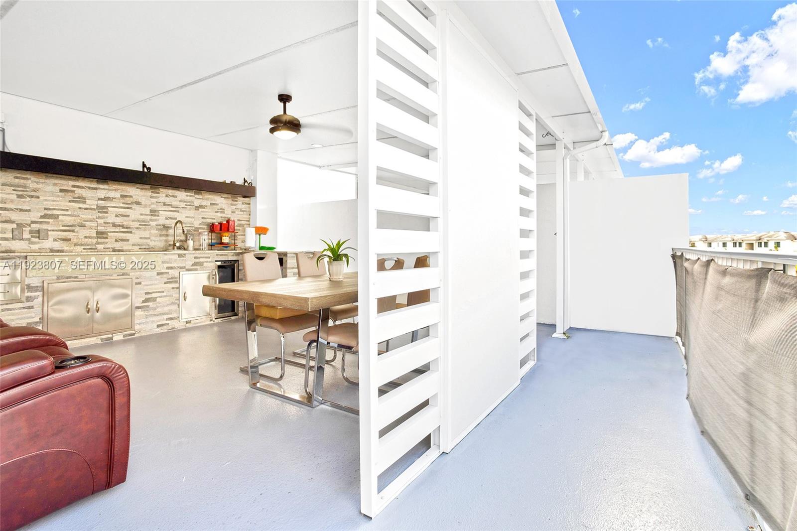 25872 Southwest 139th Path Homestead, FL 33032 - Photo 41 of 51 a view of a living room with furniture and a flat screen tv