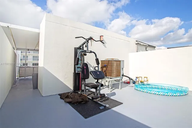 a view of a room with gym equipment