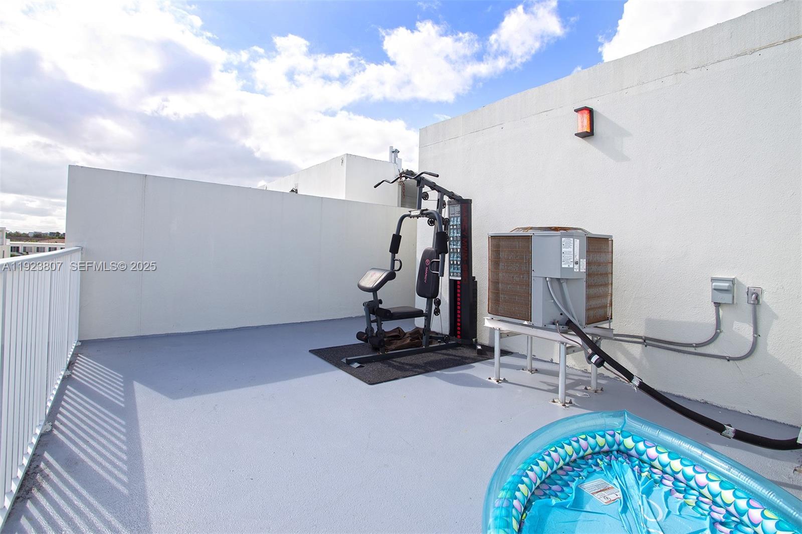 25872 Southwest 139th Path Homestead, FL 33032 - Photo 45 of 51 a view of a room with gym equipment