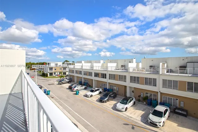 a view of building with view of swimming pool
