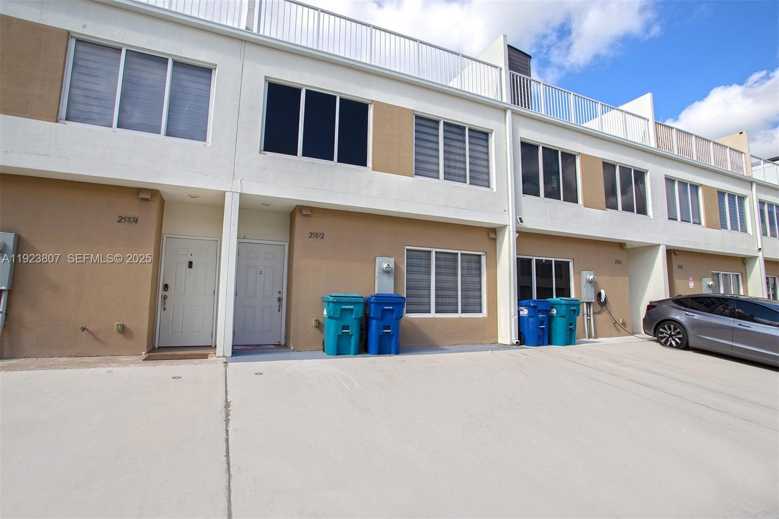 25872 Southwest 139th Path Homestead, FL 33032 - Photo 48 of 51 a view of a building with many windows