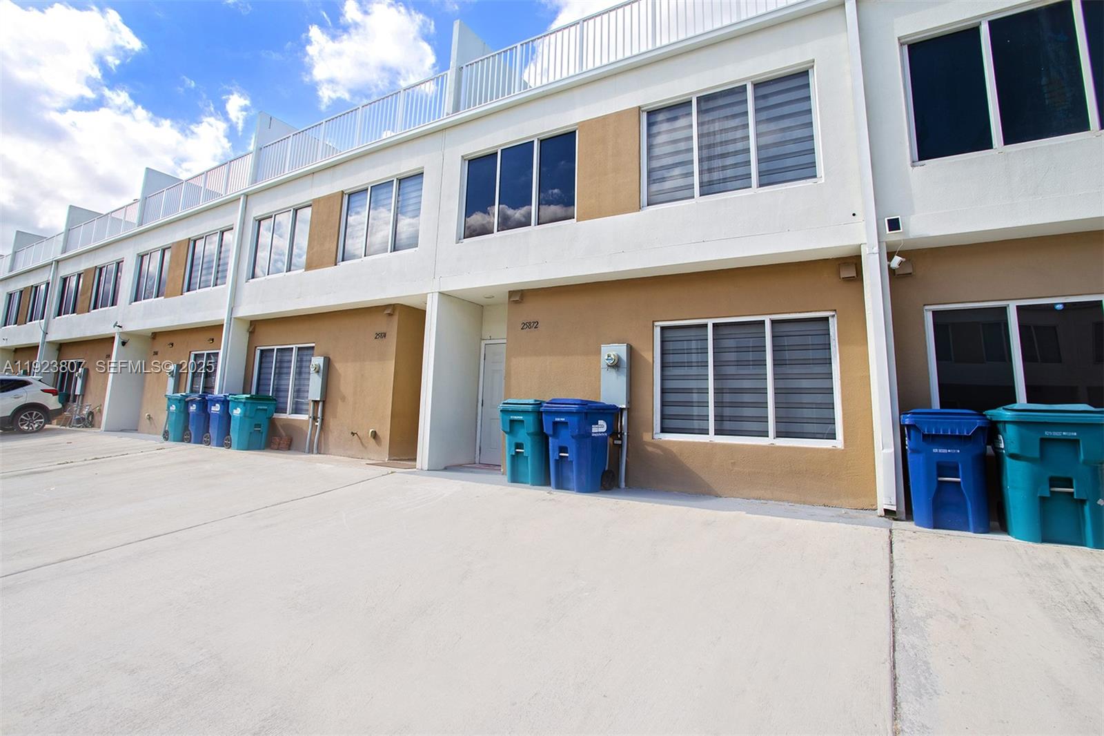25872 Southwest 139th Path Homestead, FL 33032 - Photo 49 of 51 a view of a building with large windows and a large window