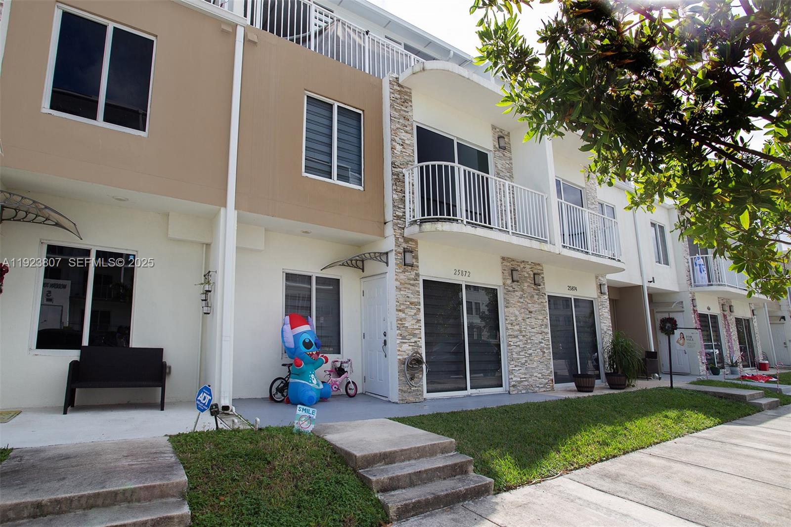 25872 Southwest 139th Path Homestead, FL 33032 - Photo 6 of 51 a view of a house with a yard and a yard