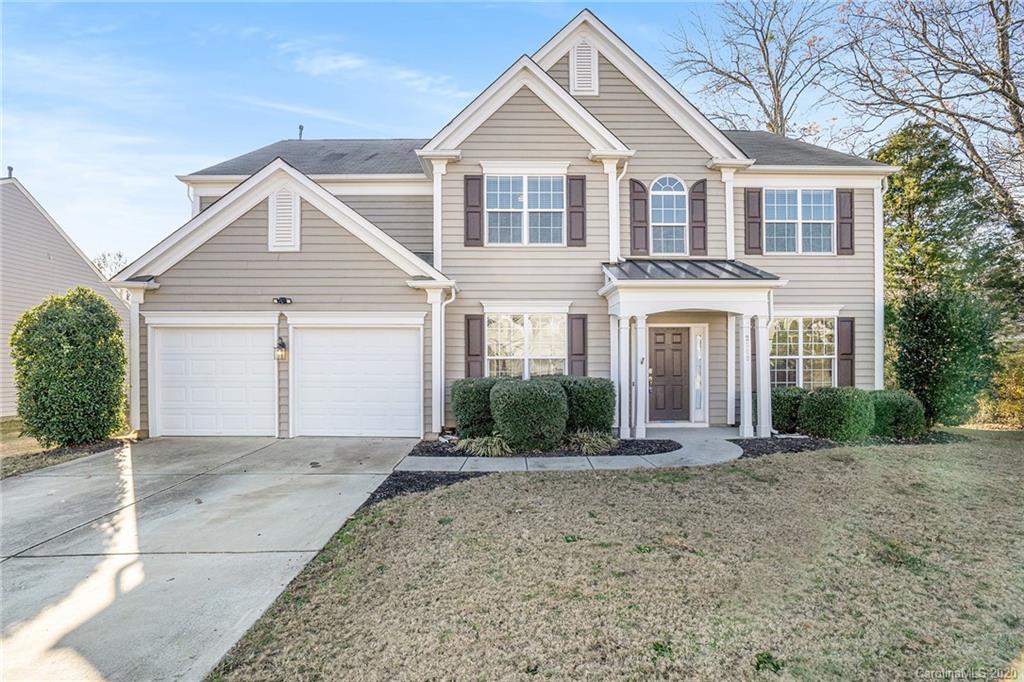 2300 Coltsgate Road Waxhaw, NC 28173 - Photo 1 of 21 a front view of a house with a yard and garage