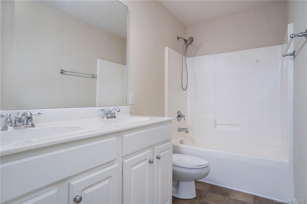 2300 Coltsgate Road Waxhaw, NC 28173 - Photo 20 of 21 a bathroom with a sink a toilet and shower