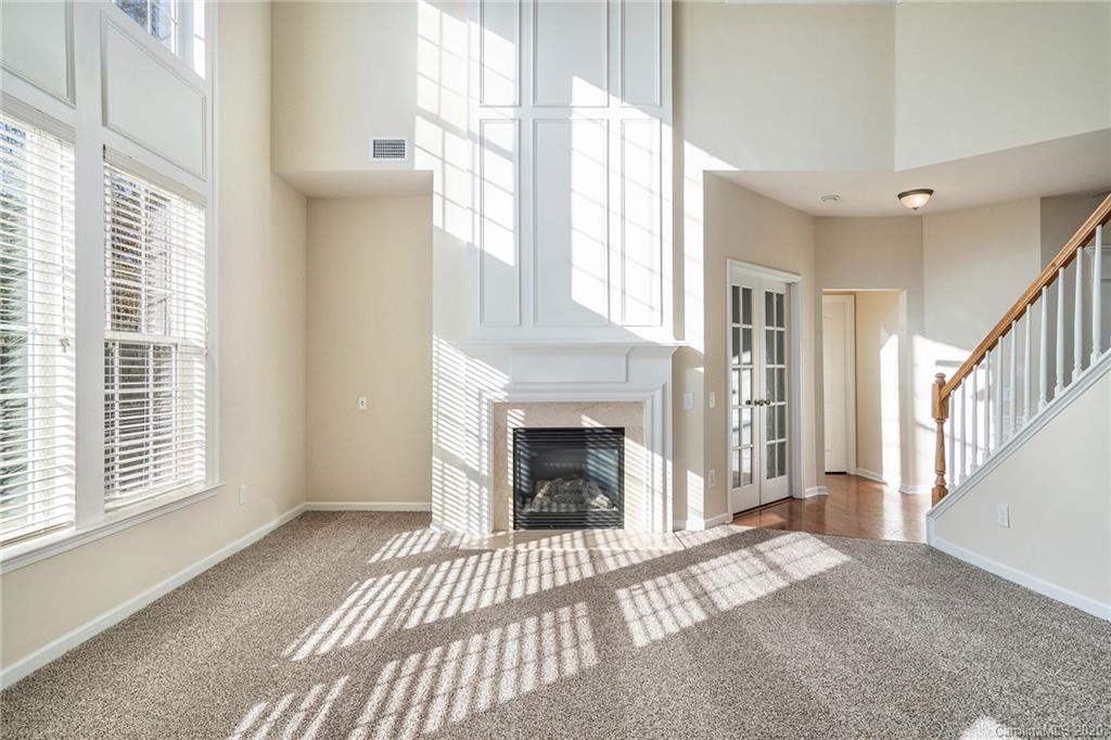 2300 Coltsgate Road Waxhaw, NC 28173 - Photo 5 of 21 a view of a livingroom with a fireplace and window
