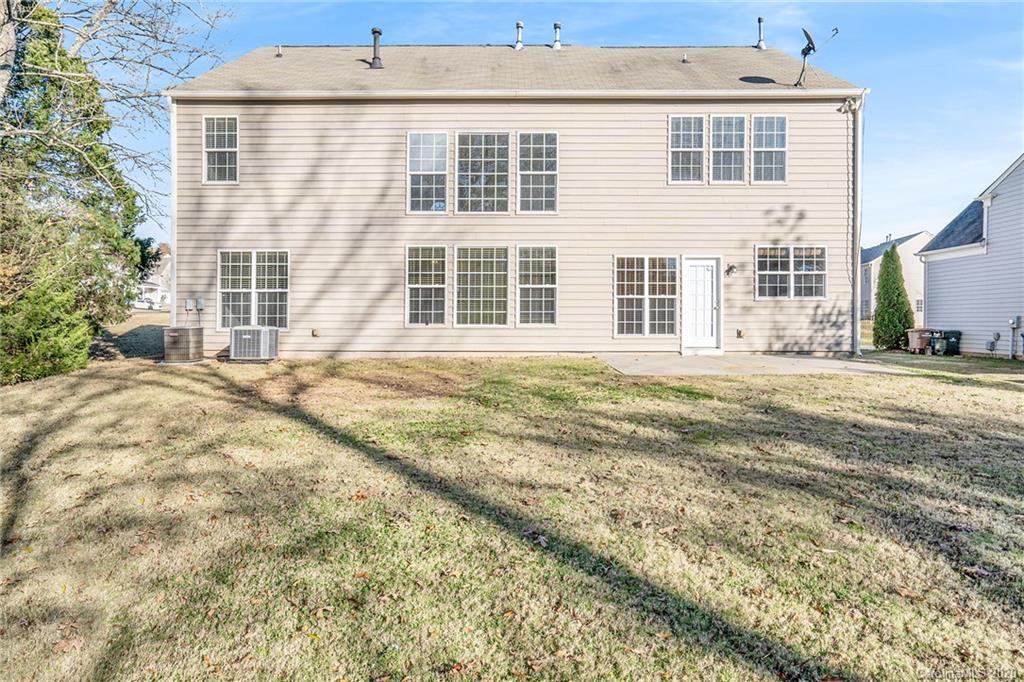 2300 Coltsgate Road Waxhaw, NC 28173 - Photo 7 of 21 a front view of a house with a garden