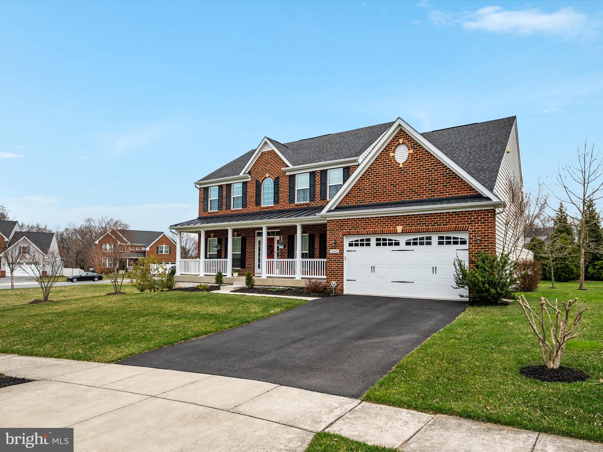 10402 Windlass Run Road Baltimore, MD 21220 - Photo 6 of 72 a front view of a house with a yard