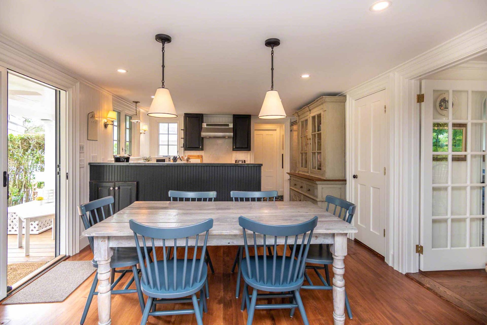 16 Mill Street Edgartown, MA 02539 - Photo 13 of 42 a view of a dining room and livingroom with furniture wooden floor a chandelier