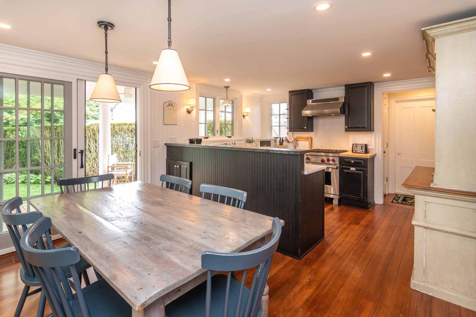 16 Mill Street Edgartown, MA 02539 - Photo 15 of 42 a dining room with furniture and wooden floor
