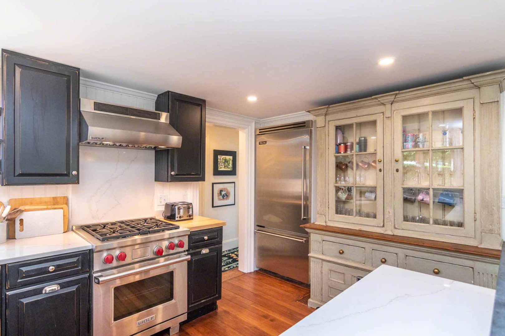 16 Mill Street Edgartown, MA 02539 - Photo 18 of 42 a kitchen with stainless steel appliances granite countertop a stove and a refrigerator
