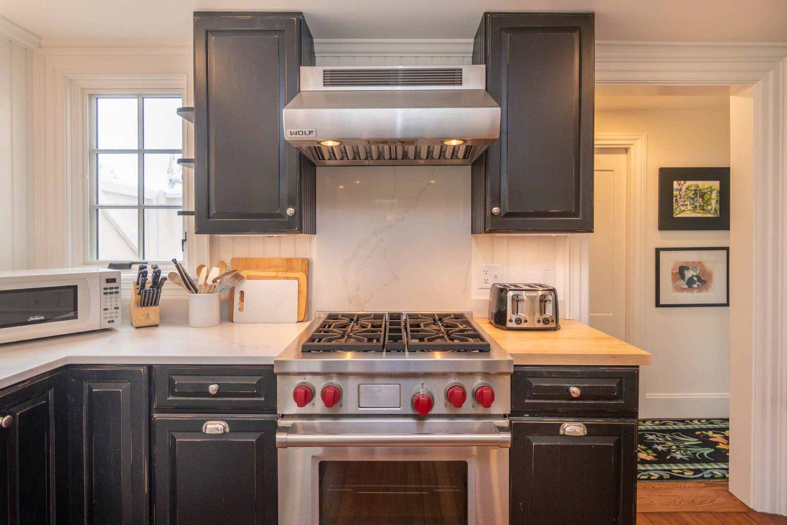 16 Mill Street Edgartown, MA 02539 - Photo 19 of 42 a kitchen with stainless steel appliances granite countertop a stove and a refrigerator
