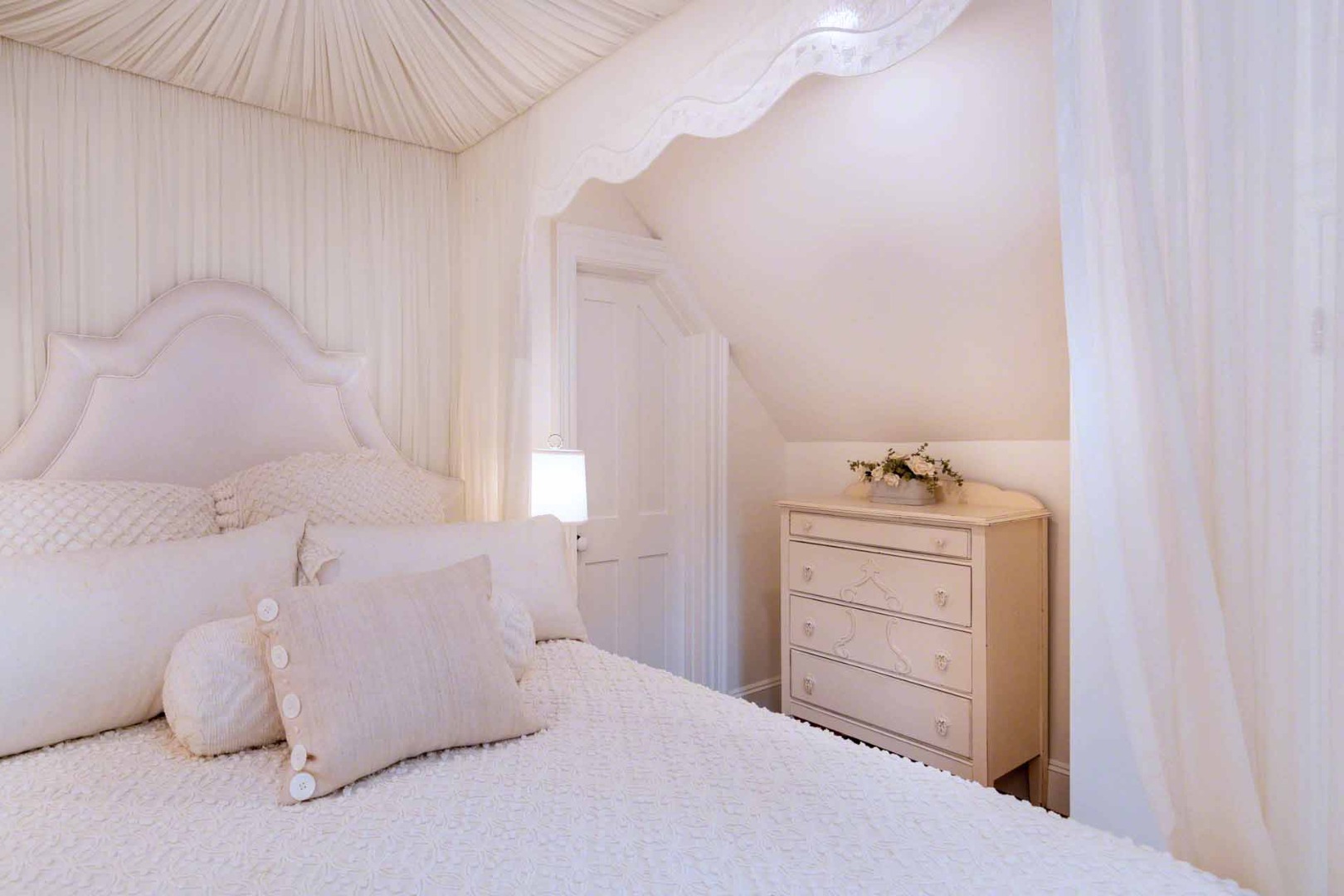 16 Mill Street Edgartown, MA 02539 - Photo 28 of 42 a bedroom with a bed and a dresser