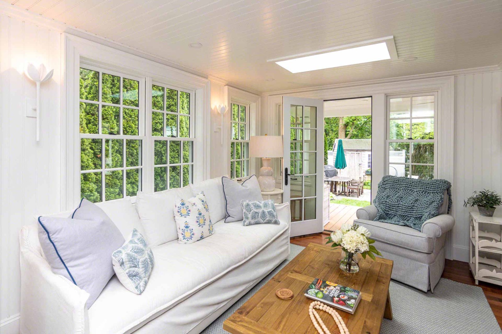 16 Mill Street Edgartown, MA 02539 - Photo 9 of 42 a living room with furniture and floor to ceiling windows