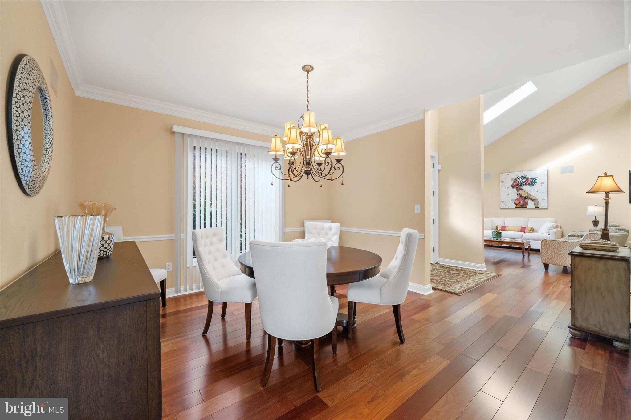 103 Downs Drive Wilmington, DE 19807 - Photo 11 of 70 a dining room with furniture a chandelier and wooden floor