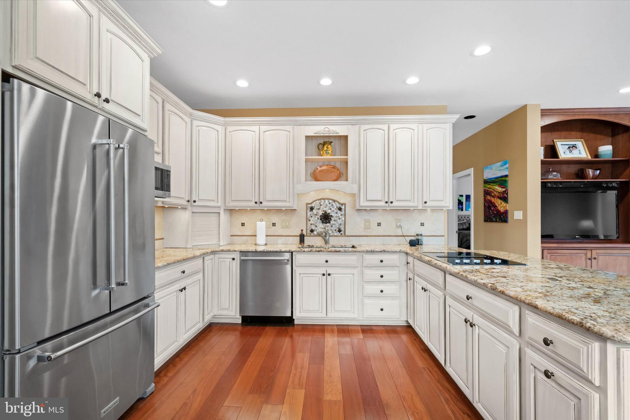 103 Downs Drive Wilmington, DE 19807 - Photo 14 of 70 a kitchen with granite countertop a sink stove and refrigerator
