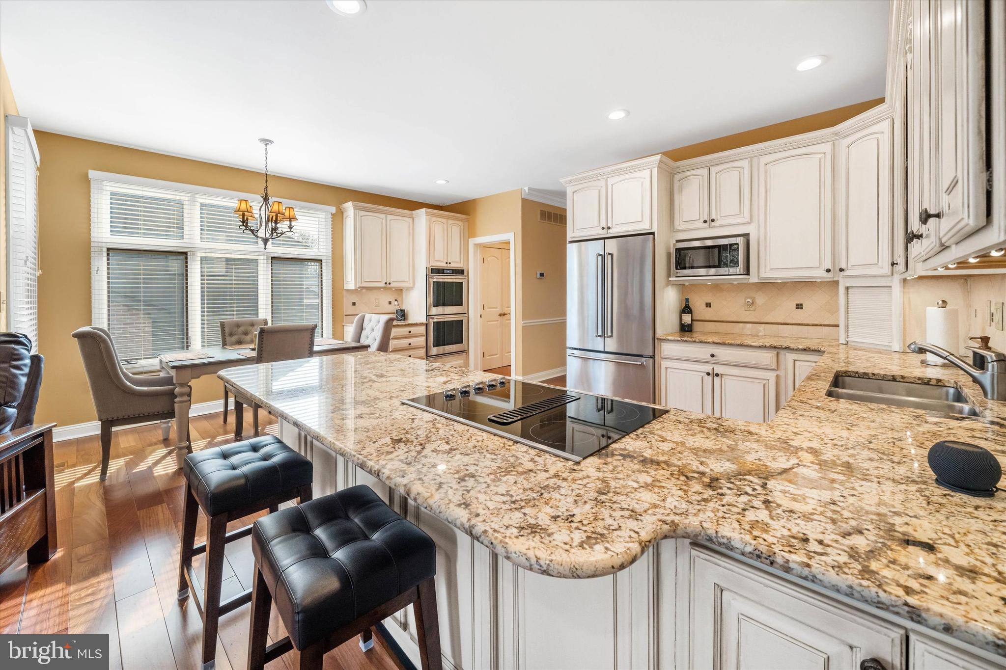 103 Downs Drive Wilmington, DE 19807 - Photo 17 of 70 a kitchen with kitchen island granite countertop a large counter top space and stainless steel appliances