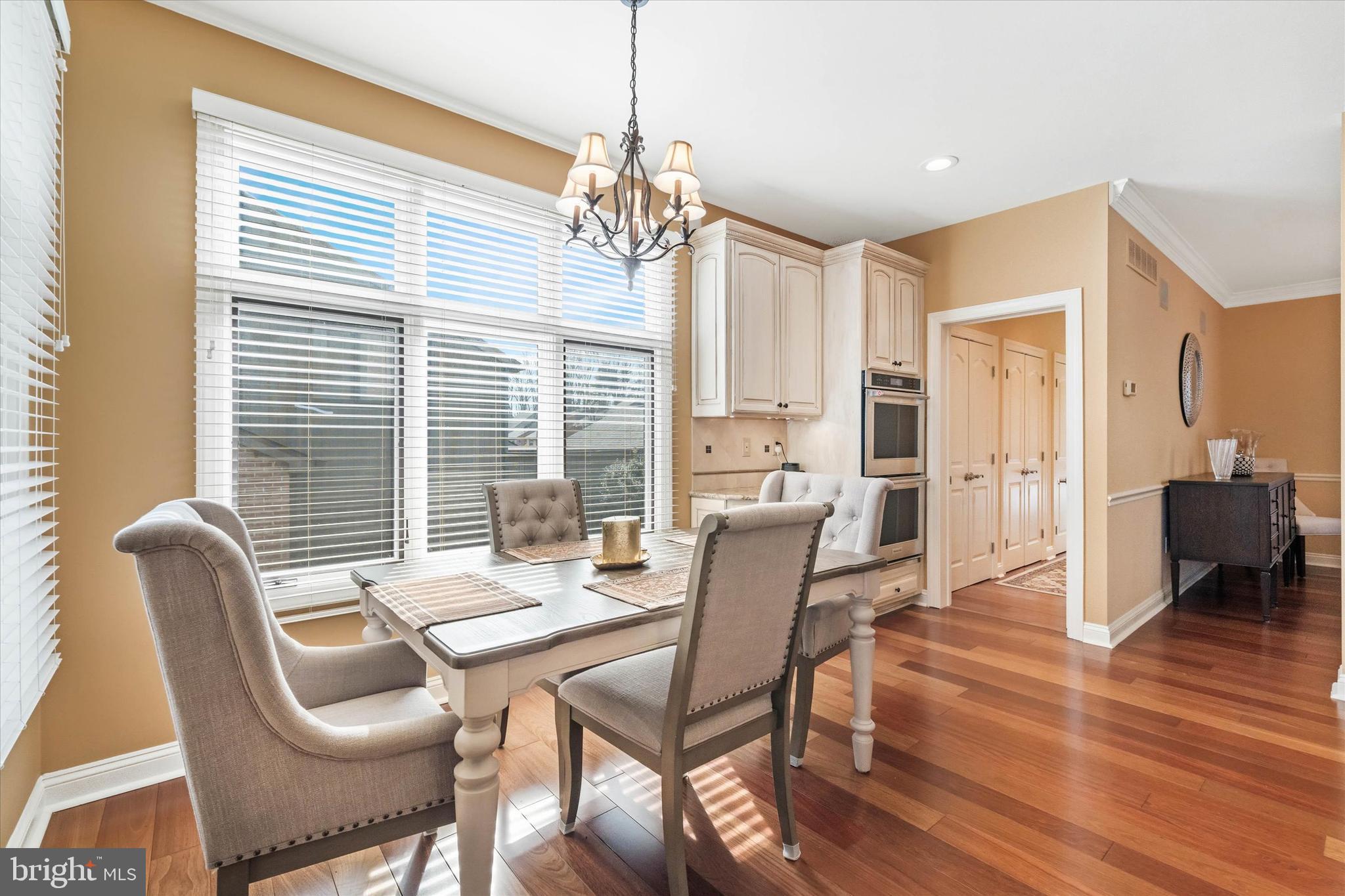 103 Downs Drive Wilmington, DE 19807 - Photo 18 of 70 a dining room with furniture a chandelier and wooden floor