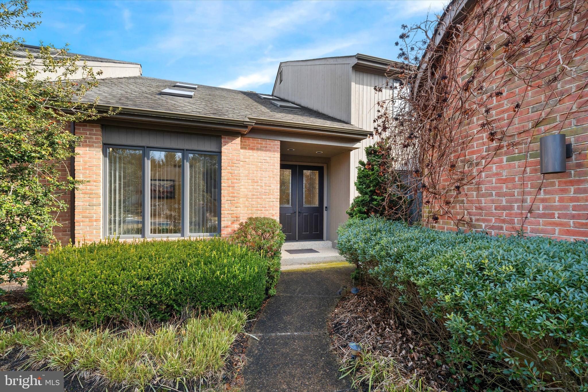 103 Downs Drive Wilmington, DE 19807 - Photo 2 of 70 a front view of a house with garden