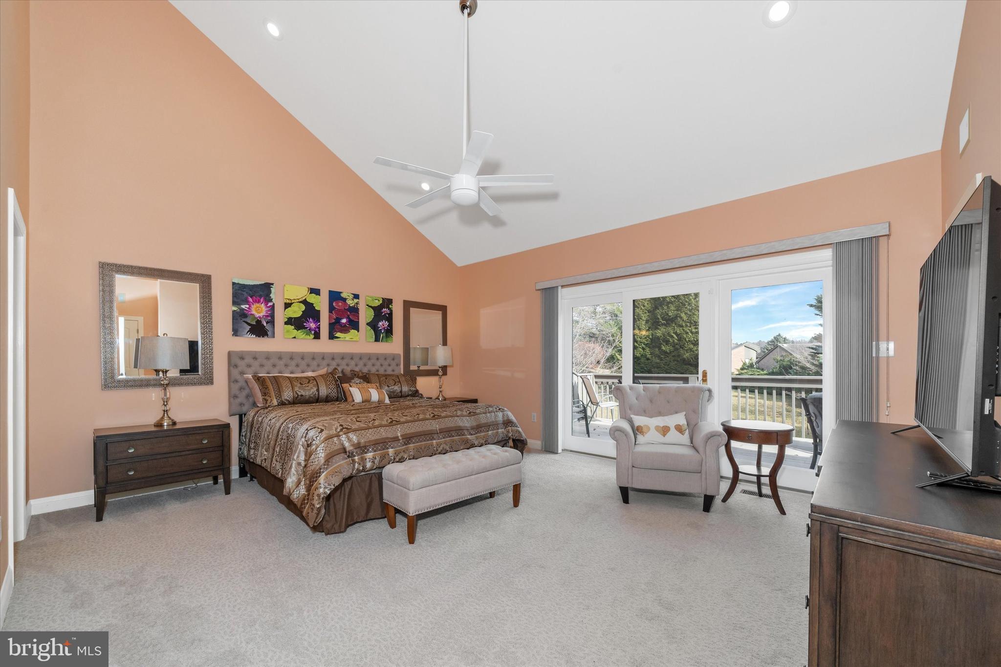 103 Downs Drive Wilmington, DE 19807 - Photo 27 of 70 a living room with a bed furniture flat screen tv and a large window