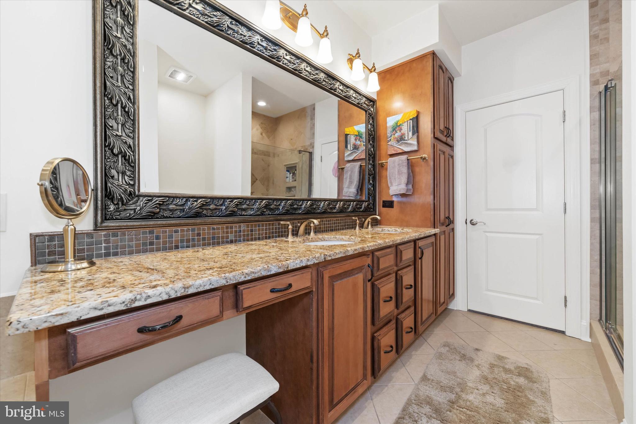 103 Downs Drive Wilmington, DE 19807 - Photo 31 of 70 a bathroom with a double vanity sink and a mirror