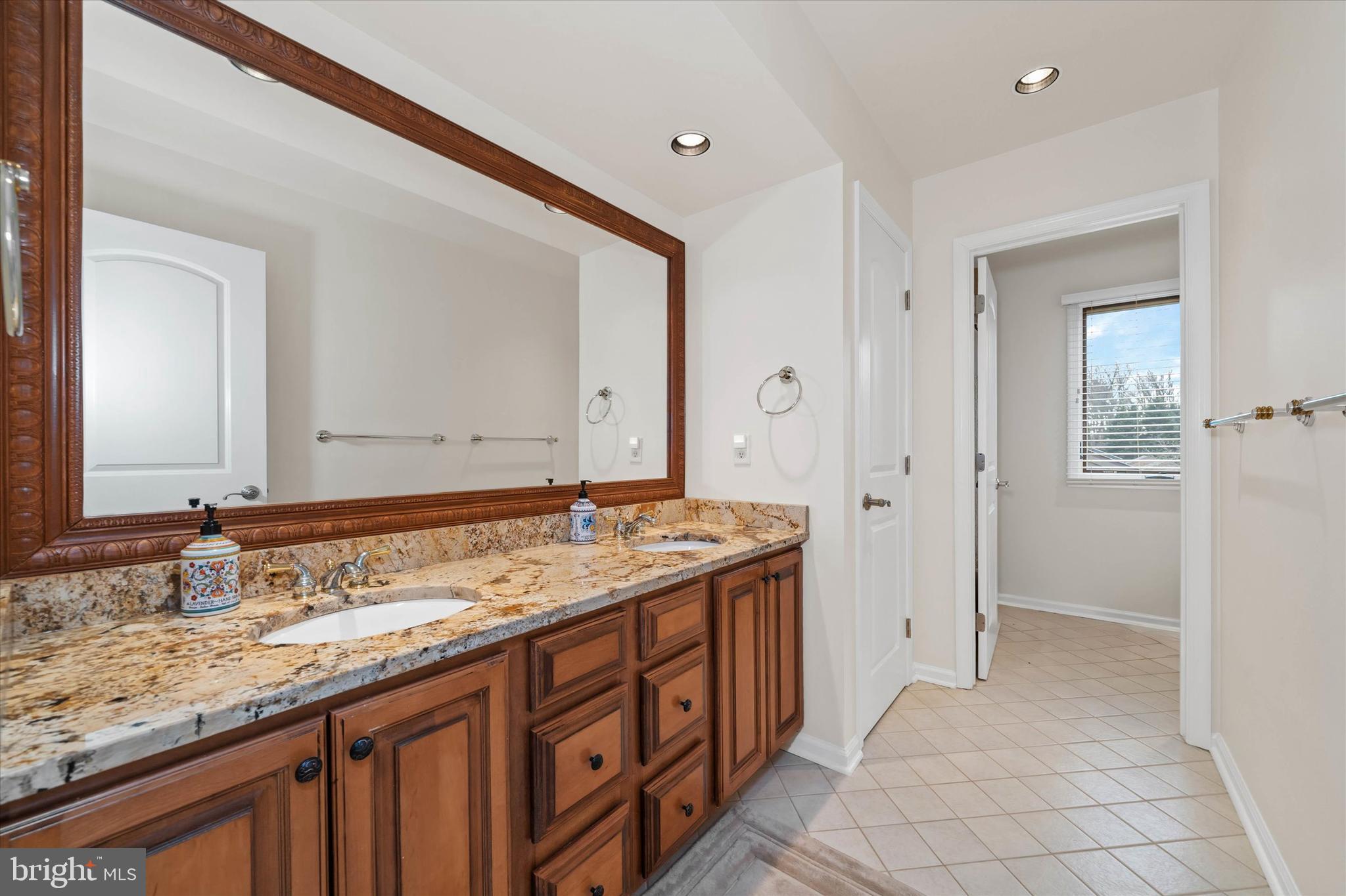 103 Downs Drive Wilmington, DE 19807 - Photo 42 of 70 a bathroom with a granite countertop double vanity sink and a mirror