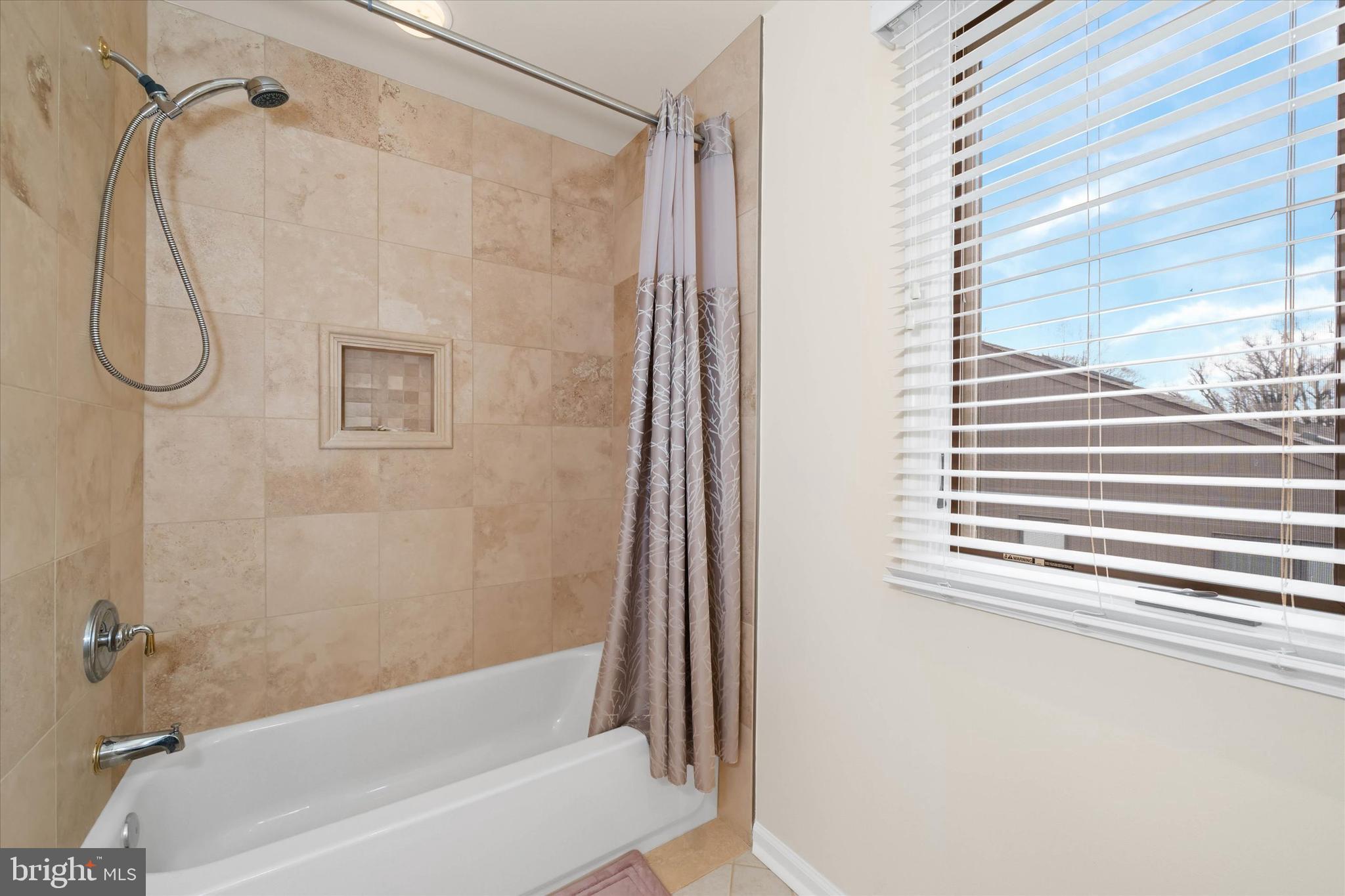 103 Downs Drive Wilmington, DE 19807 - Photo 43 of 70 a bathroom with a shower and a bathtub