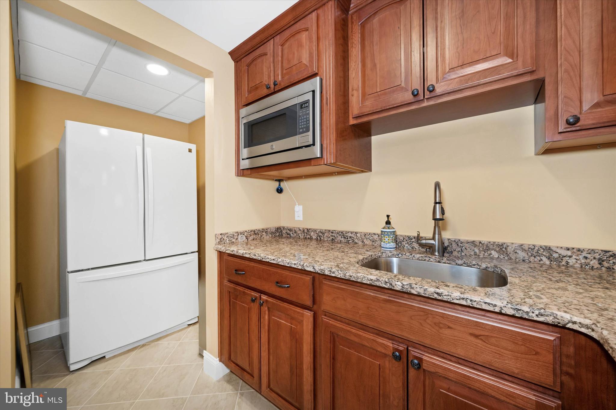 103 Downs Drive Wilmington, DE 19807 - Photo 50 of 70 a kitchen with granite countertop cabinets stainless steel appliances and a sink
