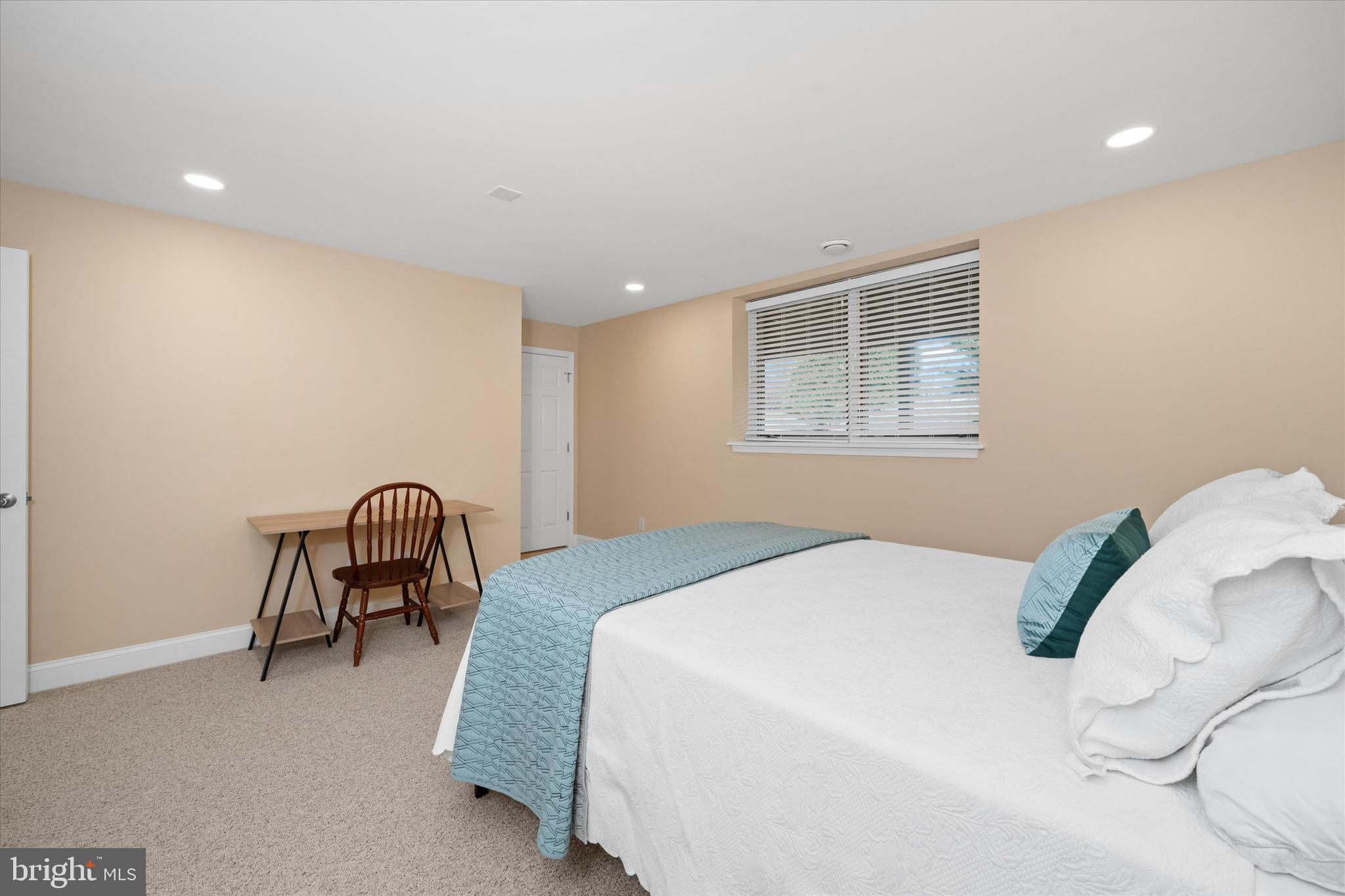103 Downs Drive Wilmington, DE 19807 - Photo 54 of 70 a bedroom with a bed chair and a window