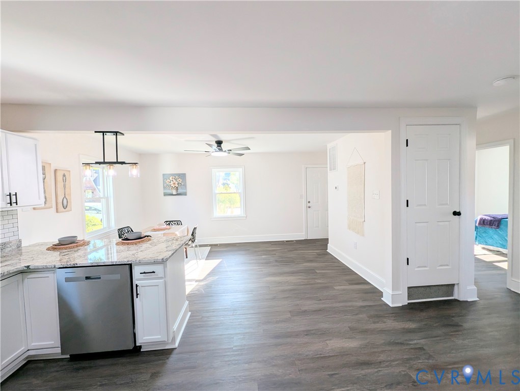 407 Washington Avenue Colonial Heights, VA 23834 - Photo 13 of 41 Kitchen with white cabinets, light stone counterto