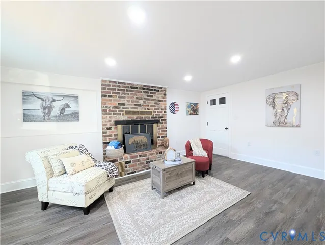 a living room with furniture or couch and a fireplace