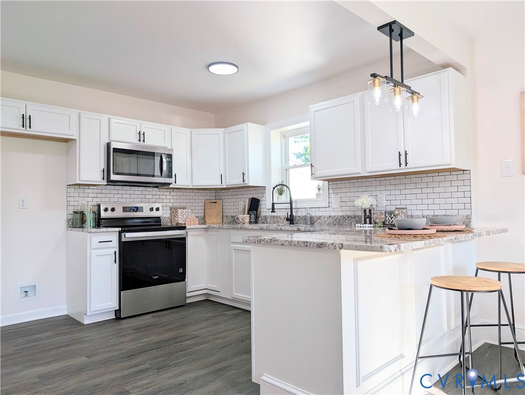 407 Washington Avenue Colonial Heights, VA 23834 - Photo 6 of 41 Kitchen with stainless steel appliances, backsplas