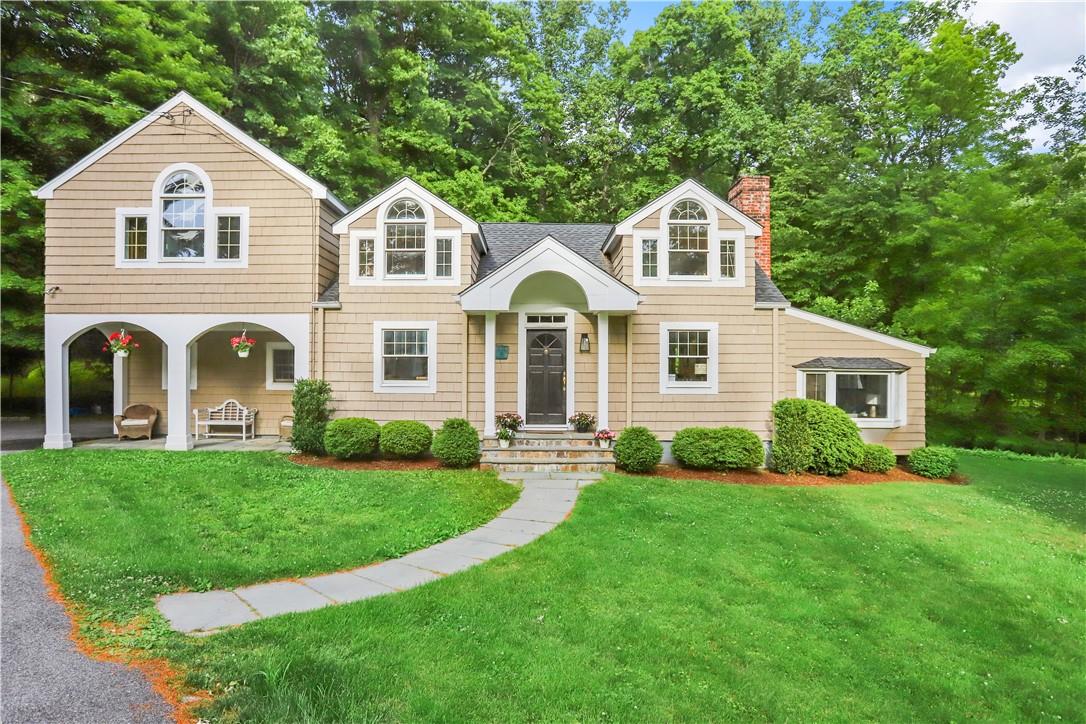 47 Old Mill Road Chappaqua, NY 10514 - Photo 1 of 1 a front view of a house with a garden and yard