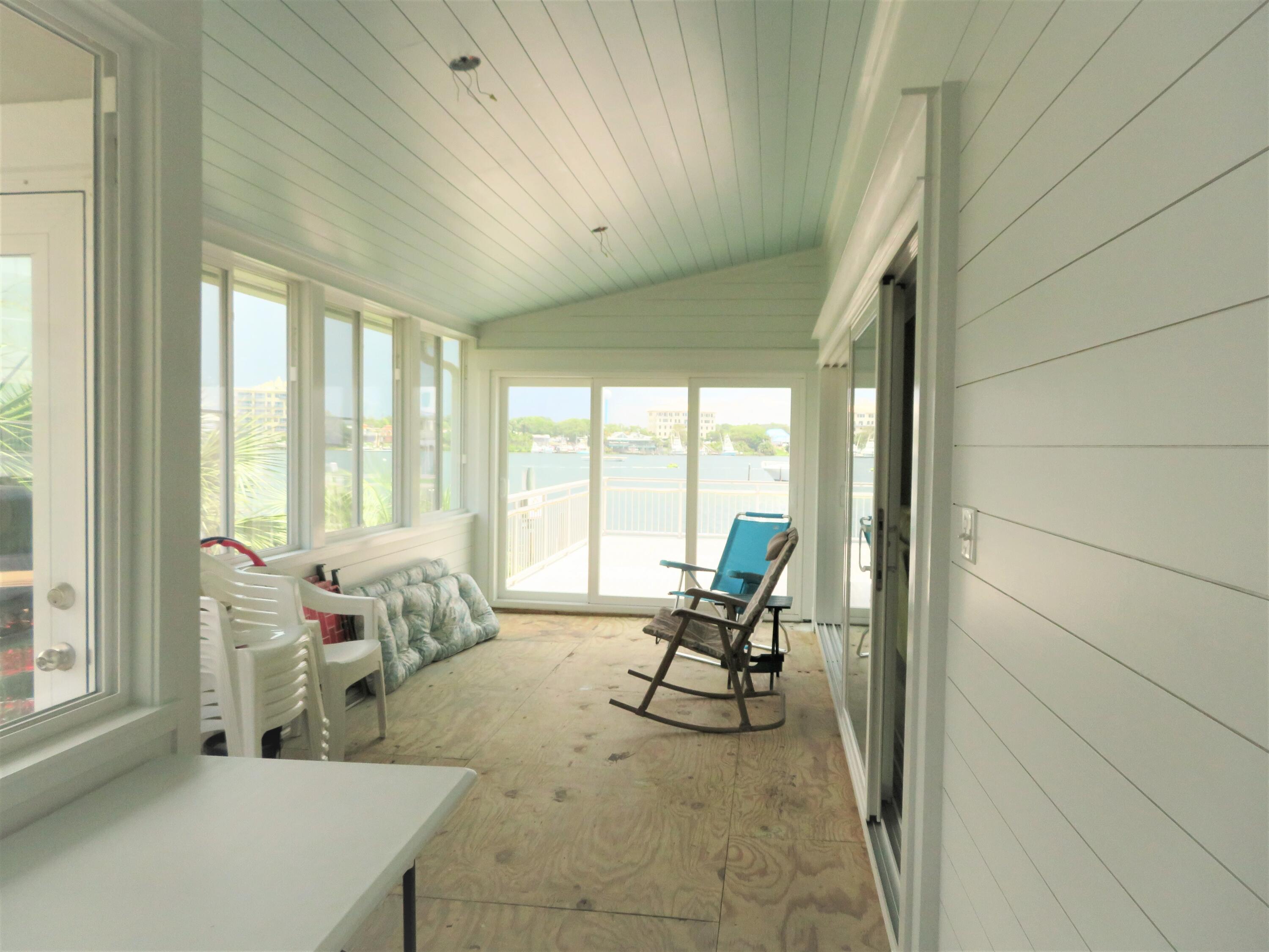 191 Durango Road Destin, FL 32541 - Photo 18 of 25 a living room with furniture and floor to ceiling windows