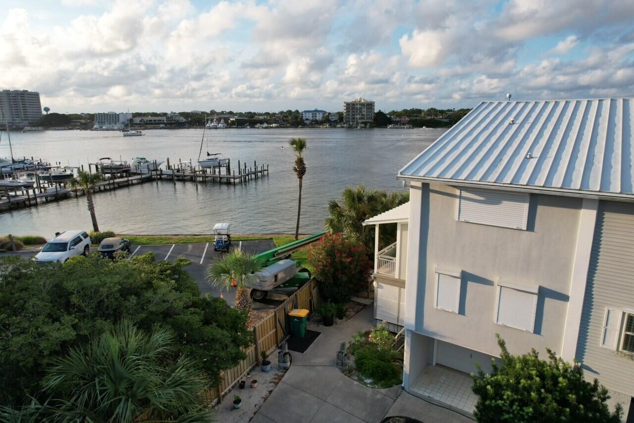 191 Durango Road Destin, FL 32541 - Photo 2 of 25 a view of a lake with a house next to a lake