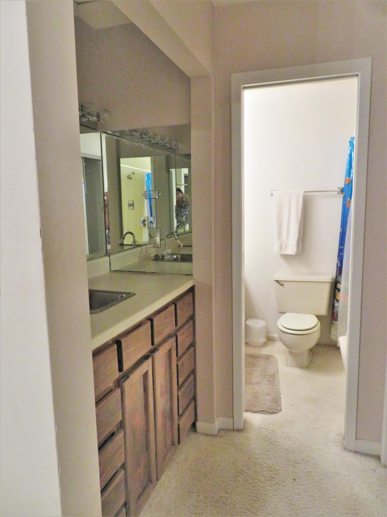 191 Durango Road Destin, FL 32541 - Photo 21 of 25 a bathroom with a sink a toilet and a mirror