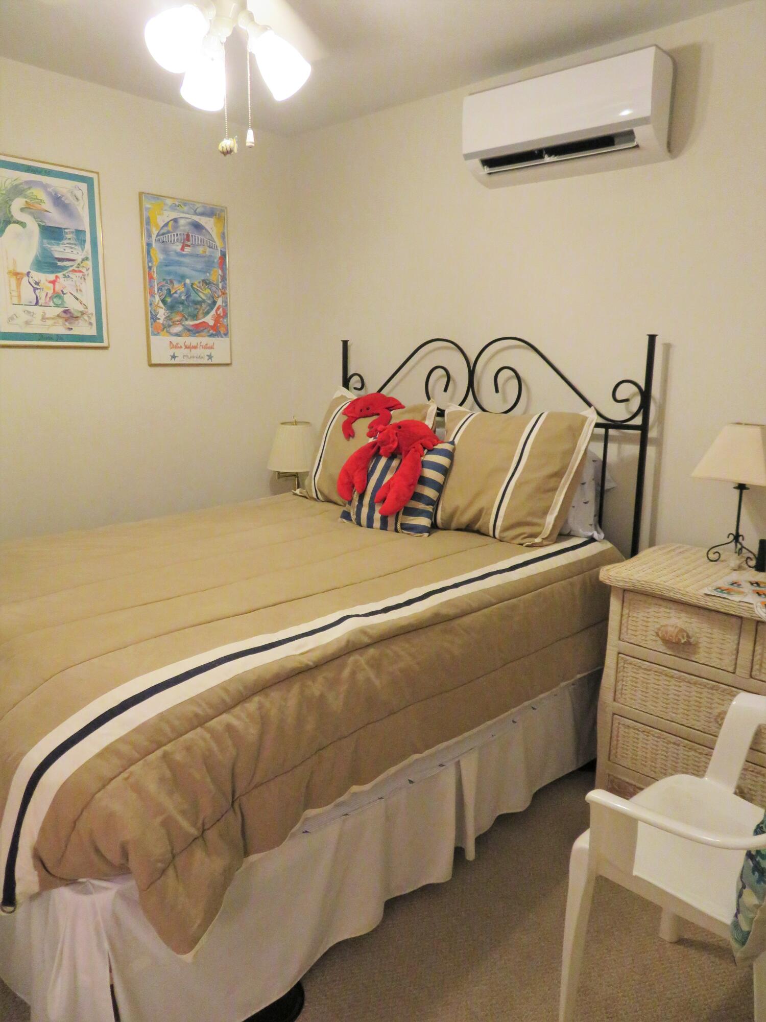 191 Durango Road Destin, FL 32541 - Photo 24 of 25 a bedroom with a bed and ceiling fan