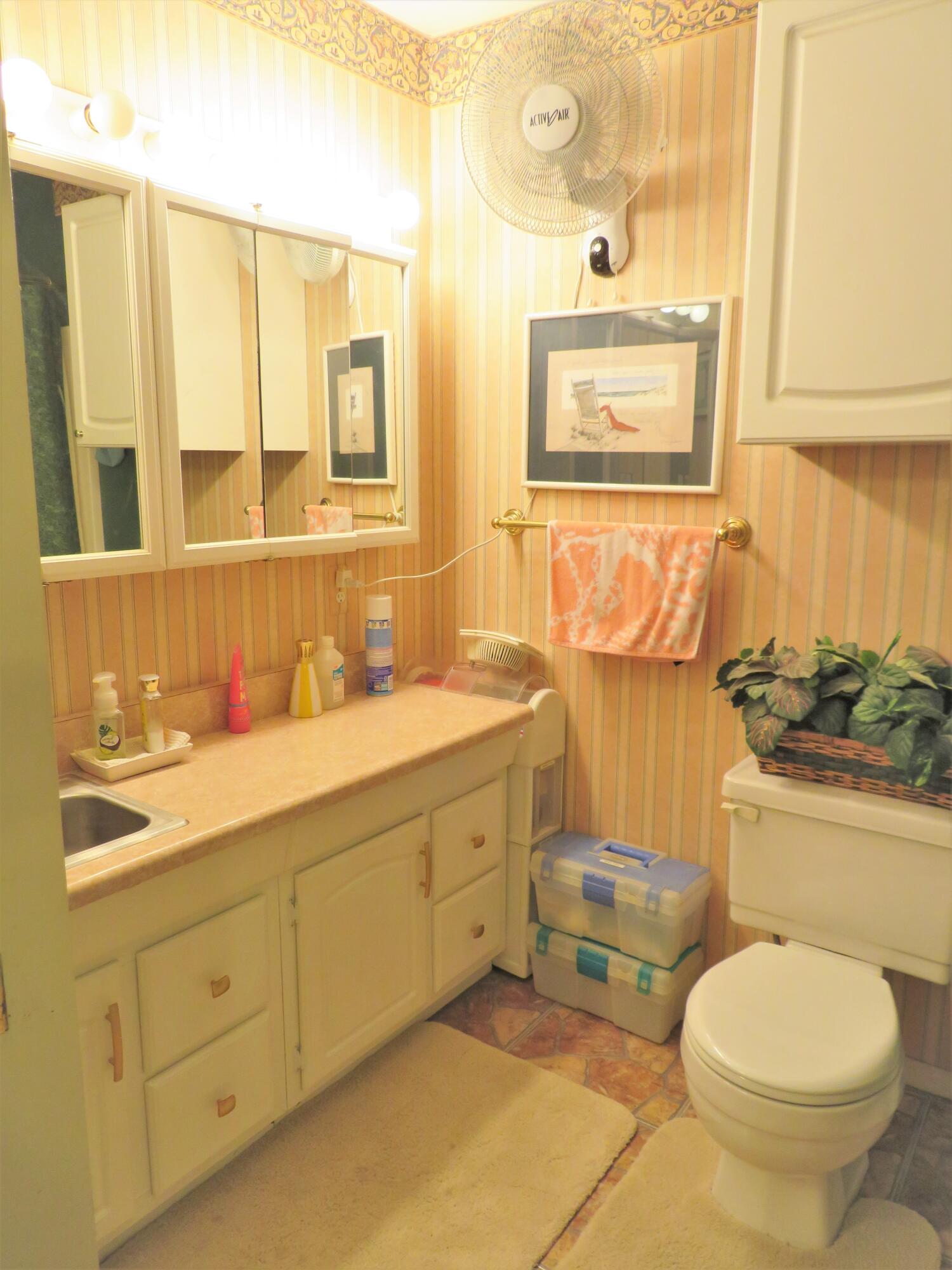 191 Durango Road Destin, FL 32541 - Photo 25 of 25 a bathroom with a granite countertop toilet sink and mirror