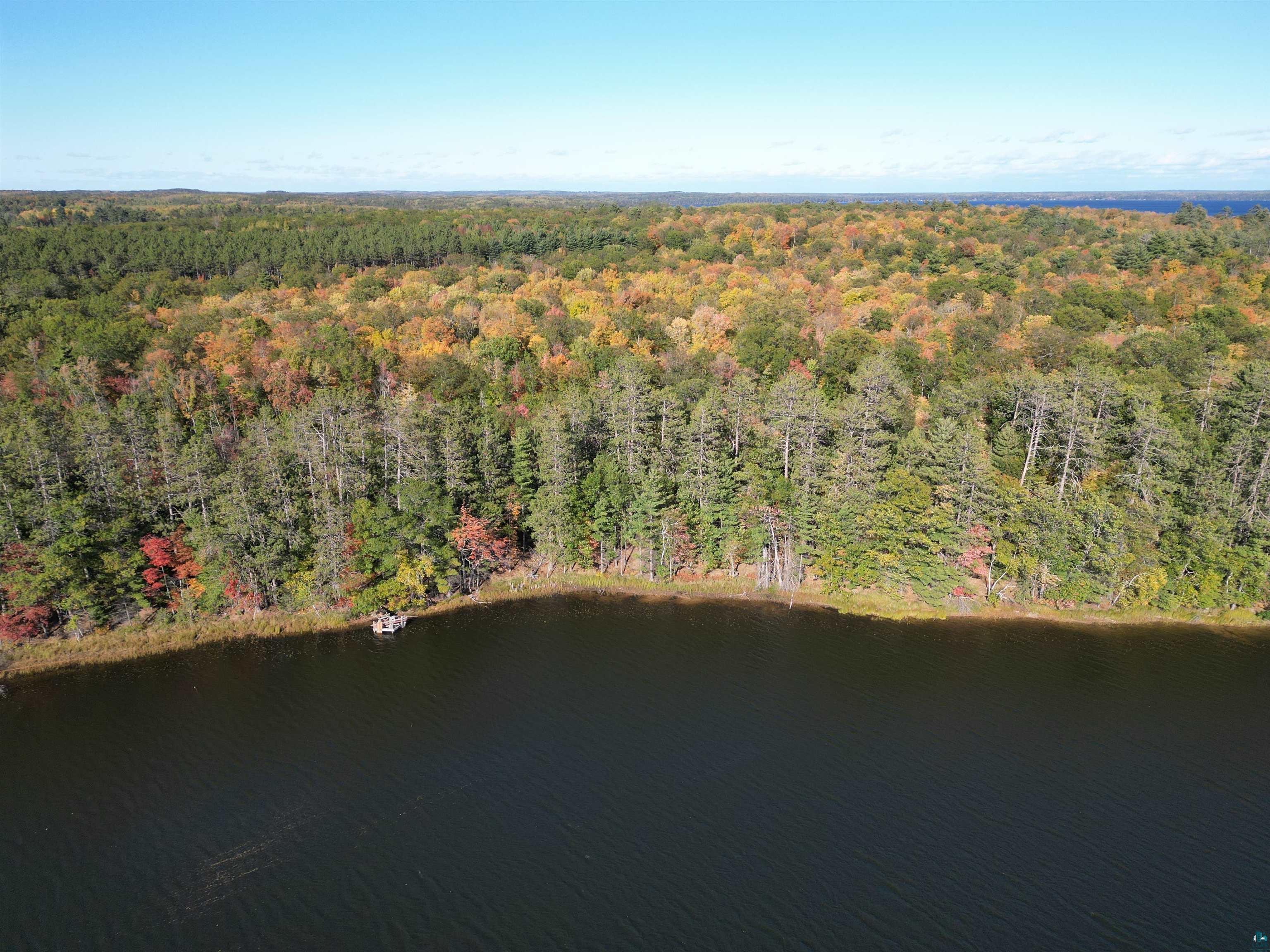 7621 White Beach Road Hayward, WI 54843 - Photo 19 of 26 Aerial overview of property's location featuring a forest and a large body of water