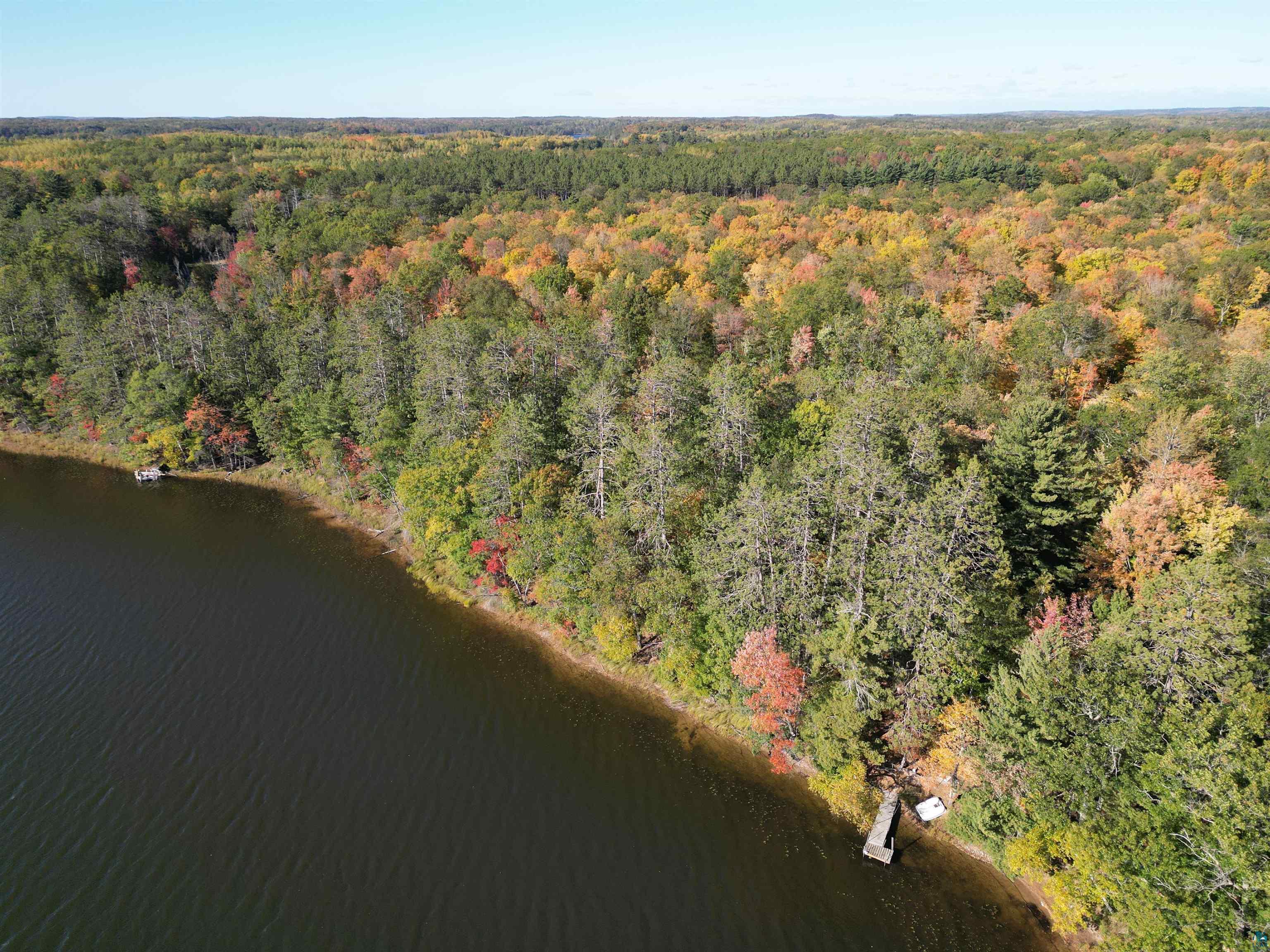 7621 White Beach Road Hayward, WI 54843 - Photo 21 of 26 Aerial view of property's location featuring a heavily wooded area and a nearby body of water