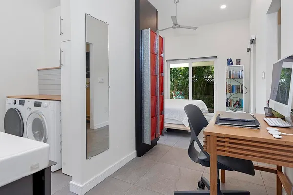a bathroom with a shower and toilet