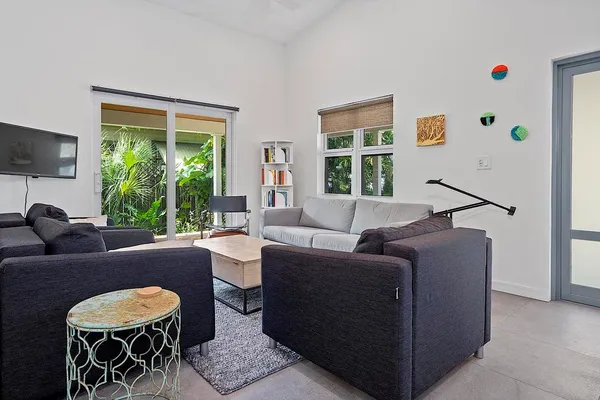 a living room with furniture and a window